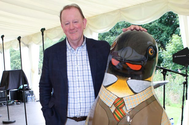 Gerard Eadie photographed with 6ft penguin sculpture by Janice Aitken