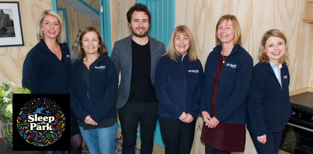 CR Smith staff members taking part in Sleep in the Park. Photographed with Josh Littlejohn MBE.