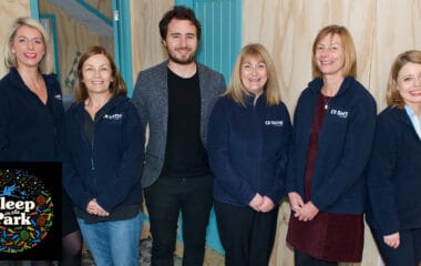 CR Smith staff members taking part in Sleep in the Park. Photographed with Josh Littlejohn MBE.