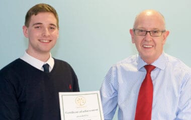 Billy Angus awarded with certificate after a Hand Picked Scotland placement with FES