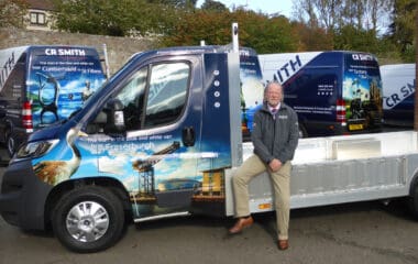 CR Smith Operations Director Hugh Eadie photographed with fleet of vans and tipper truck