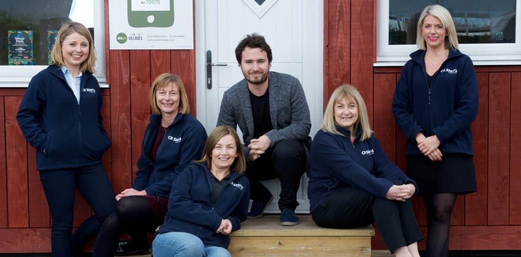 CR Smith staff members taking part in Sleep in the Park. Photographed with Josh Littlejohn MBE.