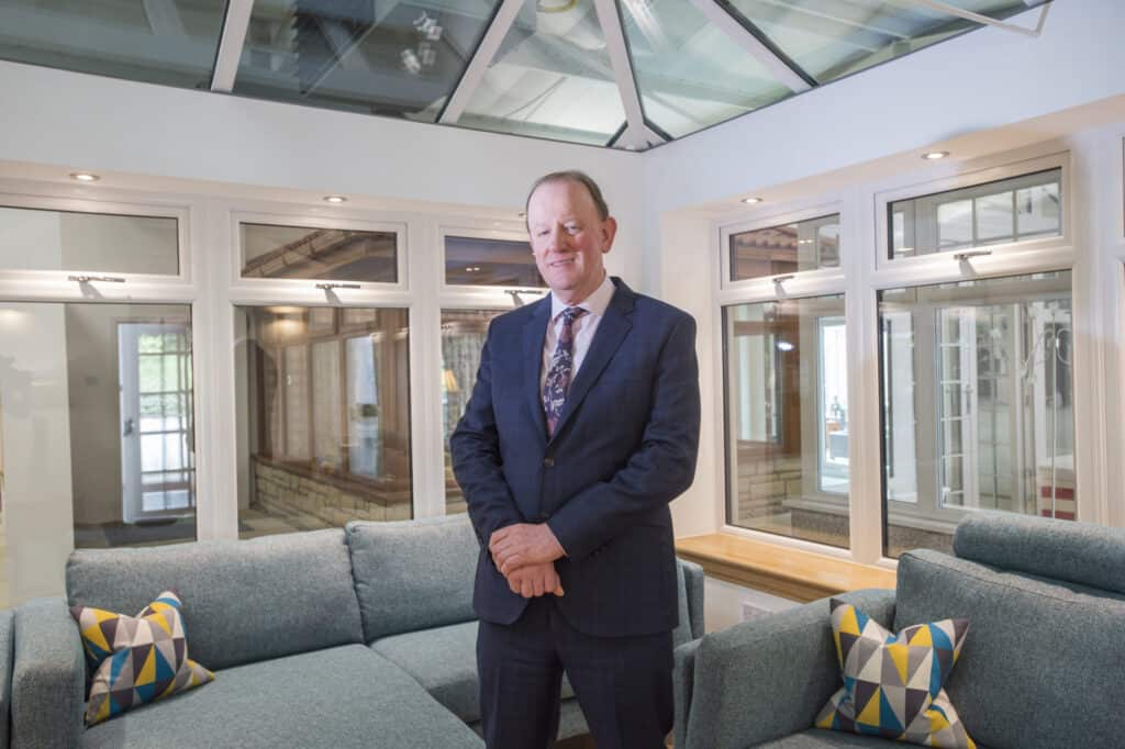 Gerard Eadie CBE photographed in a Lorimer Orangerie in the CR Smith show complex