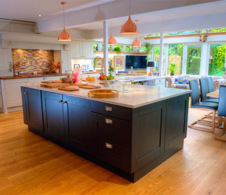 Open plan kitchen dining room within a Lorimer sunroom