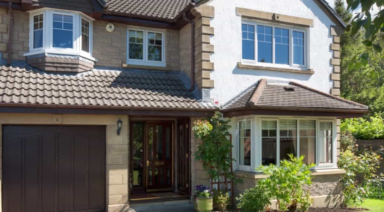 External view of home with white casement windows