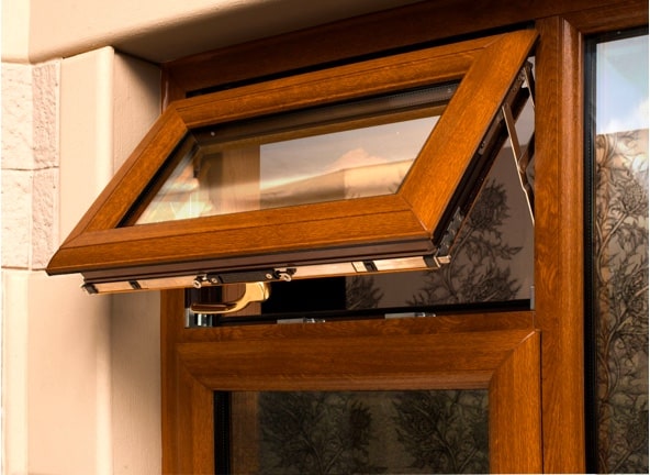 External view of an open casement window in American Light Oak uPVC
