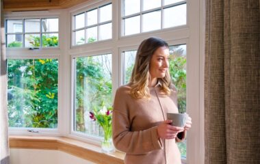 Living room window scene with white casement windows and royal oak sills and surrounds