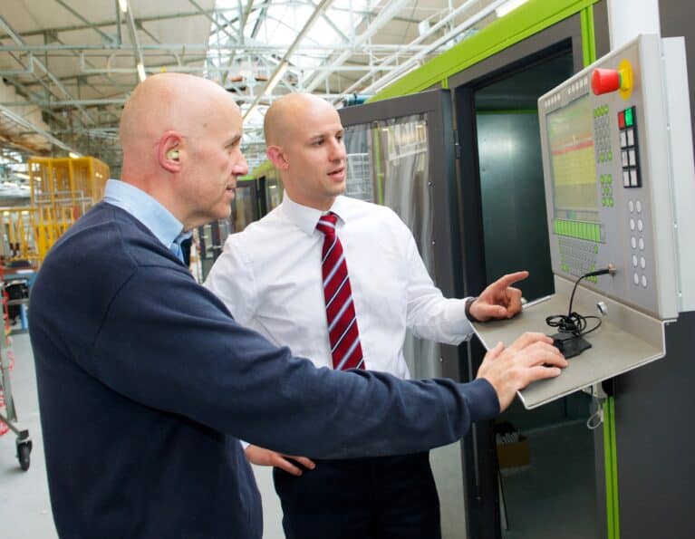 CR Smith staff using the BDM machine at the manufacturing plant