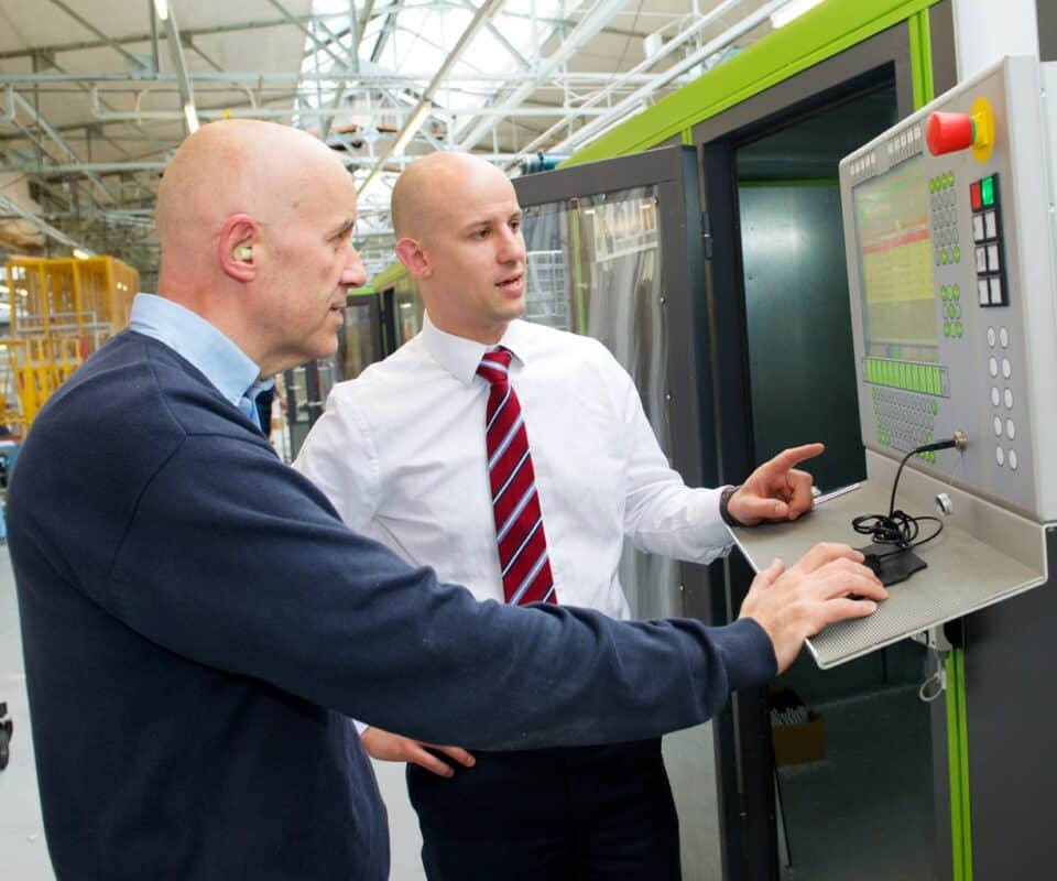 CR Smith staff using the BDM machine at the manufacturing plant