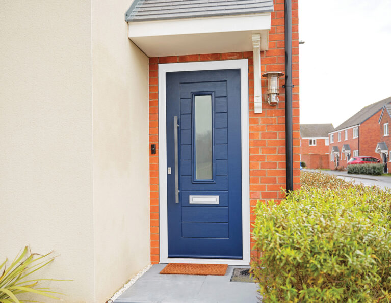 Navy blue, composite door manufactured by TimberLuxe. Complete with sand blasted glass insert and stainless steel bar handle and letter box.