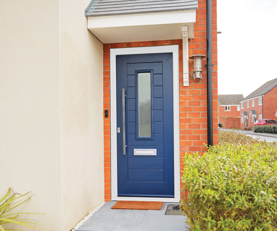 Navy blue, composite door manufactured by TimberLuxe. Complete with sand blasted glass insert and stainless steel bar handle and letter box.