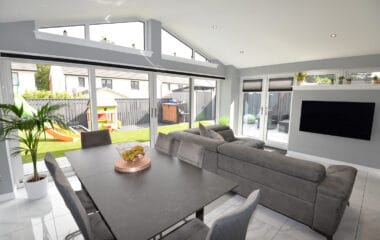 Internal view of Lorimer open plan sunroom with fully vaulted ceiling and large sliding patio doors out to the garden