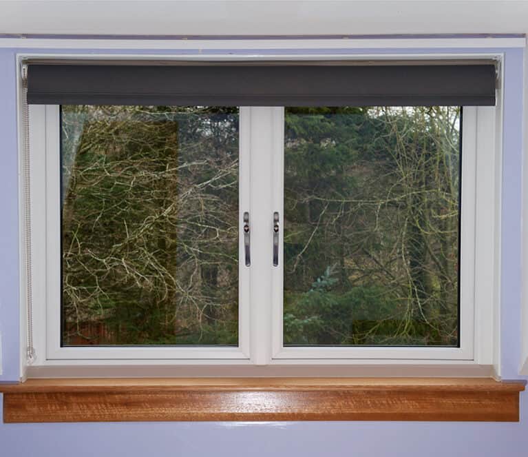 Lorimer casement window complete with white internal surrounds and oak finish sills