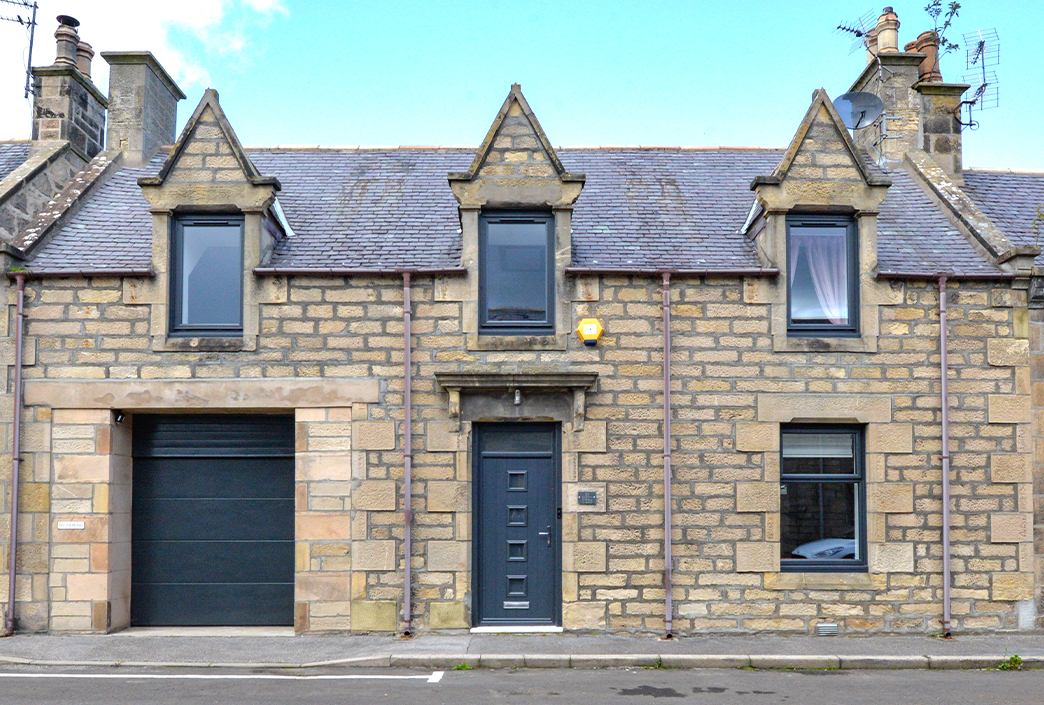 Exterior image of home with anthracite grey windows and door