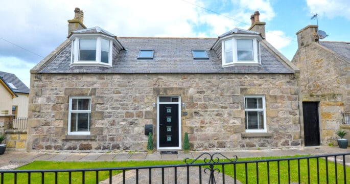 A single storey home with an attic conversion located in Peterhead, Aberdeenshire. With white upvc double-glazed windows and black composite door.