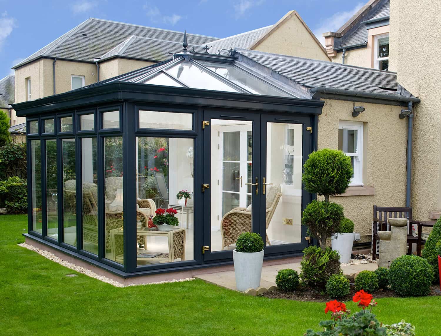 External view of anthracite grey conservatory with french doors to the garden