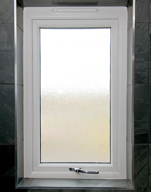 White casement window with trickle vent in bathroom