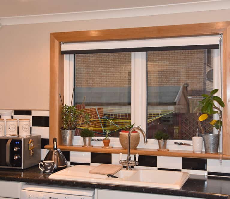 Kitchen with white casement windows finished with a royal oak timber sill and surround