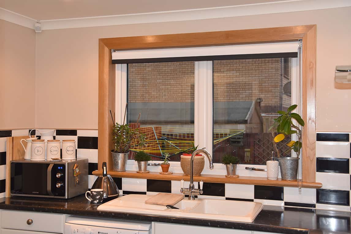 Kitchen with white casement windows finished with a royal oak timber sill and surround