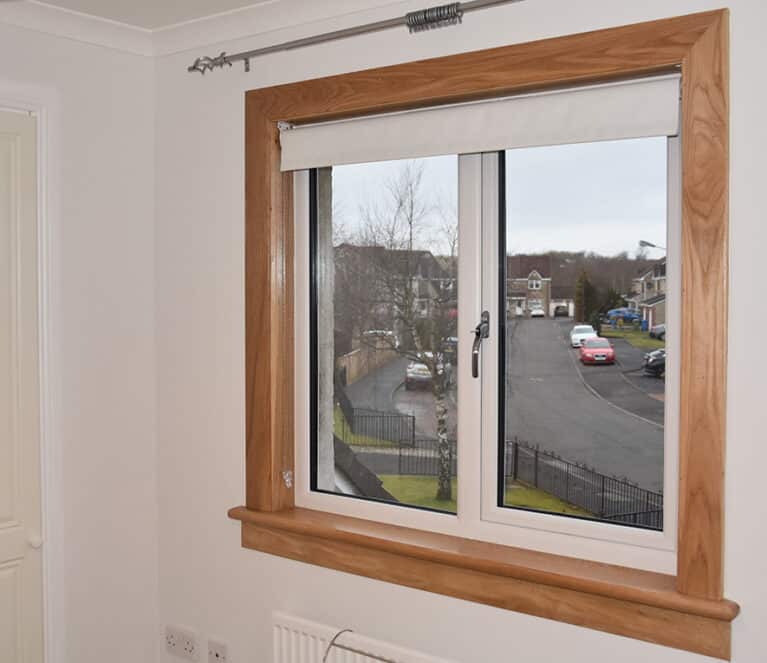 White casement window with royal oak timber sills and surround