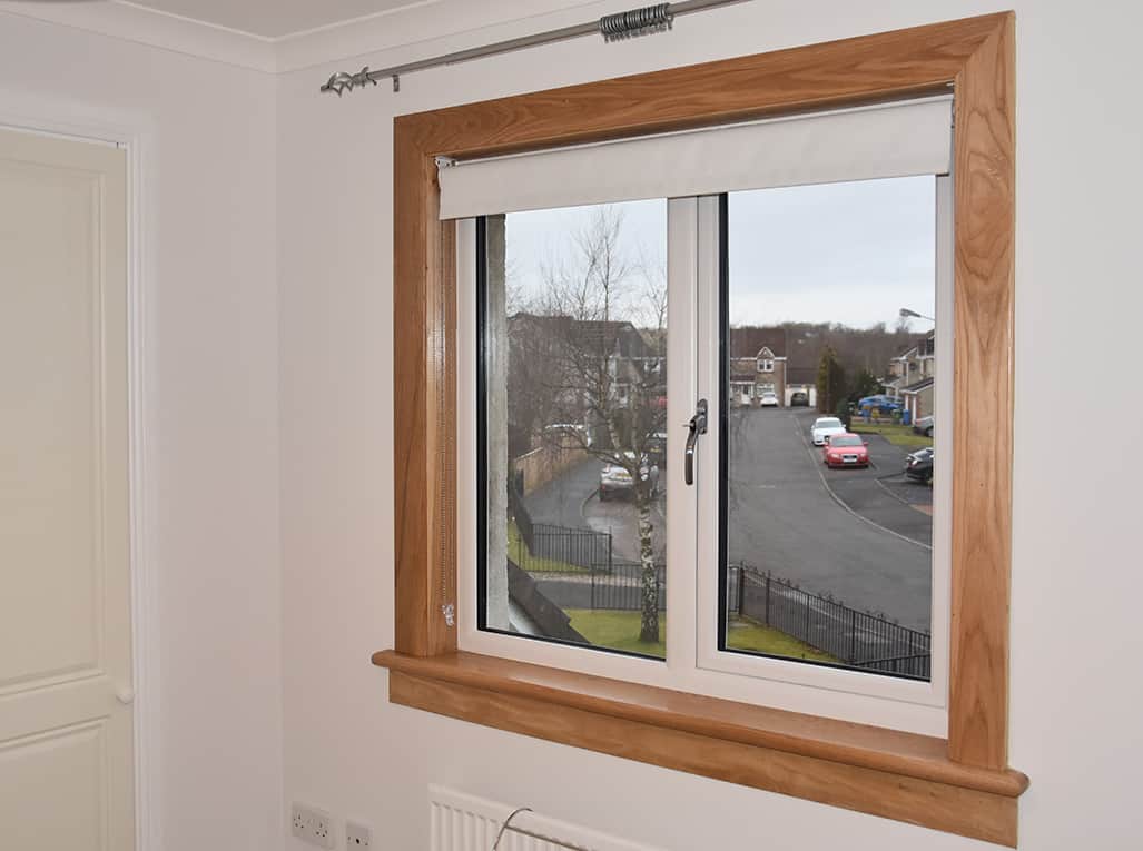 White casement window with royal oak timber sills and surround