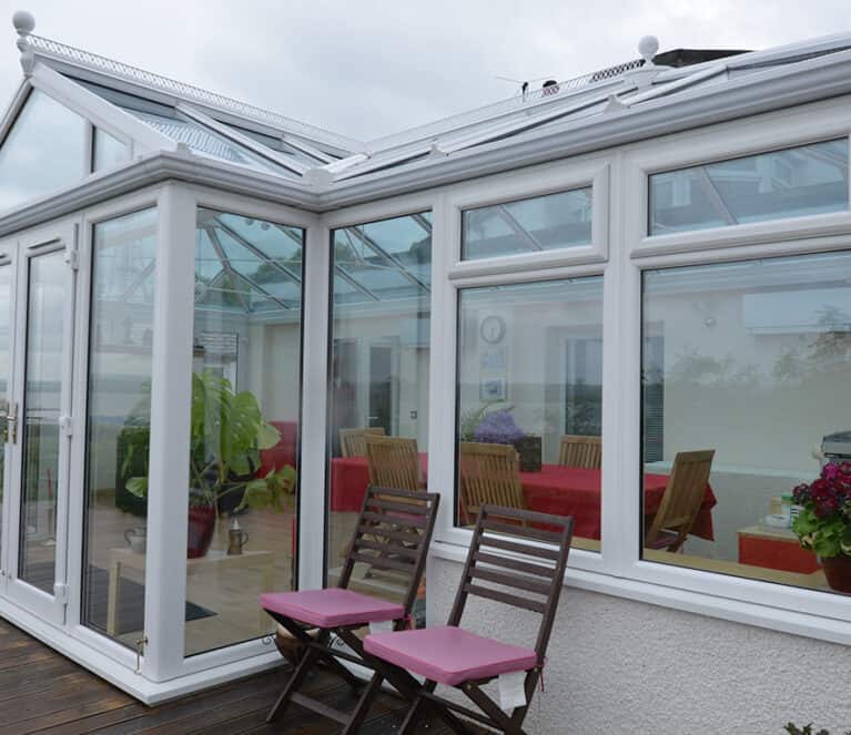 Large white conservatory with smartglass roof and climate control system