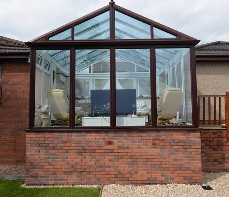 Gable front rosewood conservatory with smartglass roof