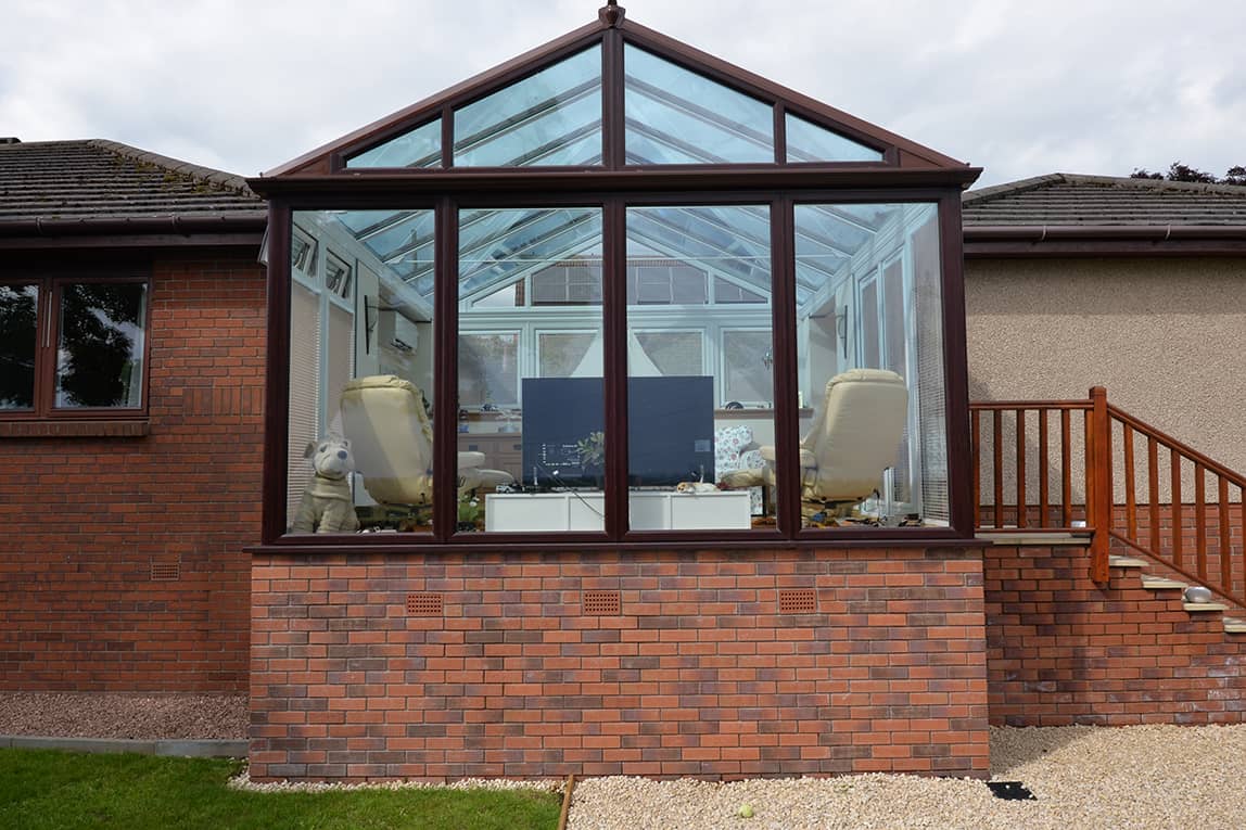 Gable front rosewood conservatory with smartglass roof
