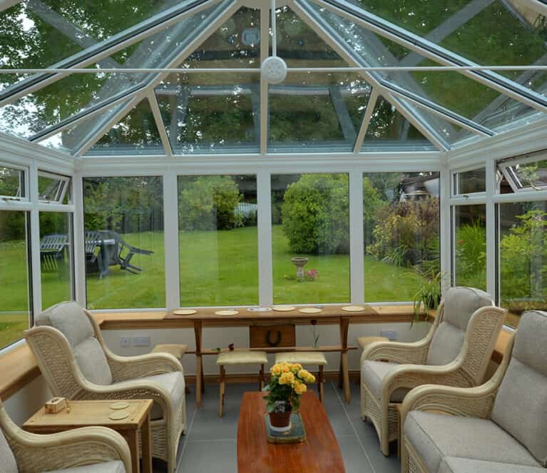 Edwardian shaped white conservatory with blue tinted smartglass roof