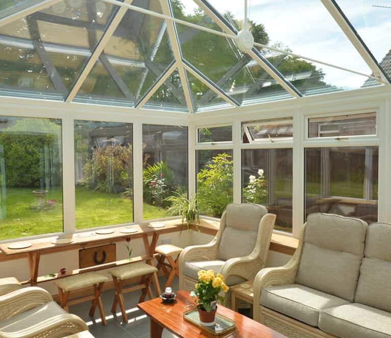 Edwardian shaped white conservatory with blue tinted smartglass roof