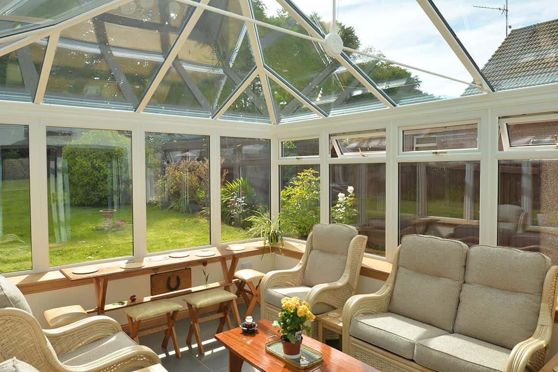 Edwardian shaped white conservatory with blue tinted smartglass roof