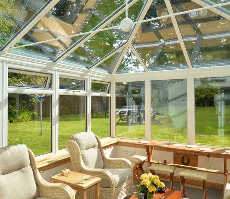 Edwardian shaped white conservatory with blue tinted smartglass roof