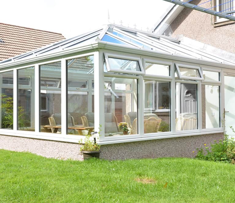 Edwardian shaped white conservatory with blue tinted smartglass roof