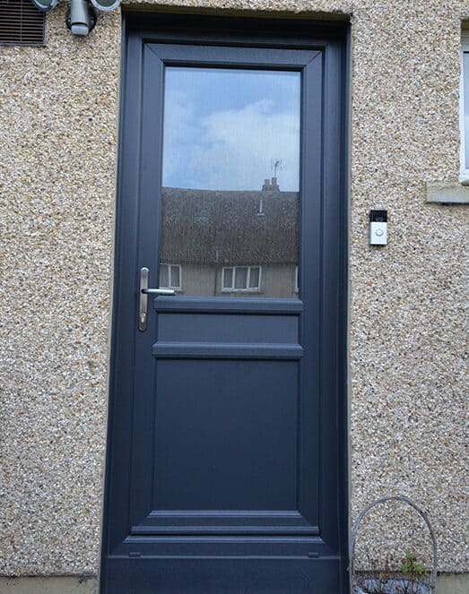 Anthracite grey uPVC door with obscure glass panel and satin chrome lever handle