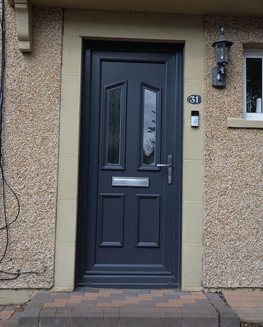 Anthracite grey uPVC front door with two glazed panels, letter plate and lever handle