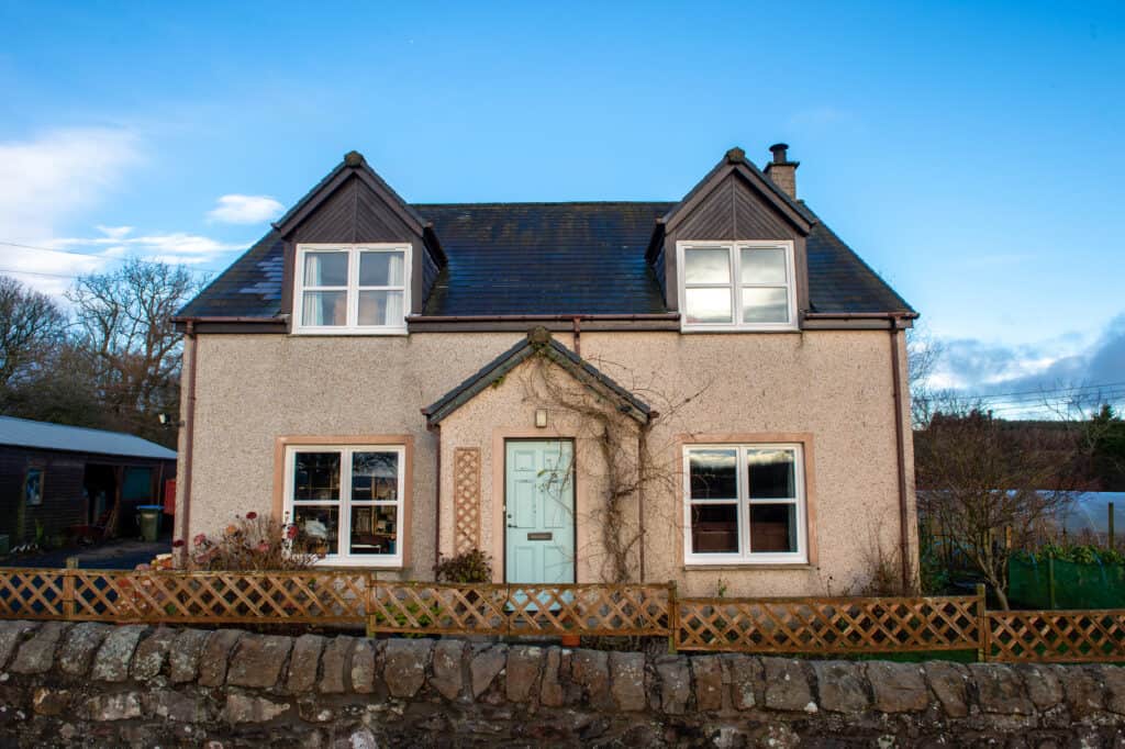 After photo. External view of home with white casement windows and tilt and turn windows