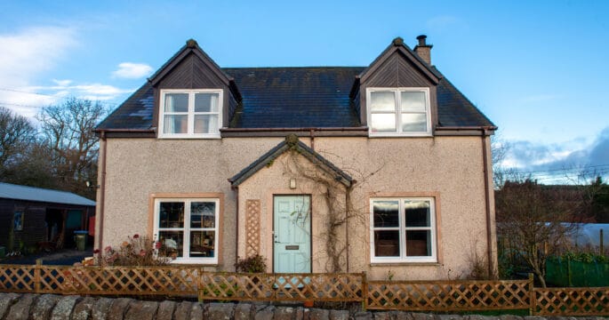 After photo. External view of home with white casement windows and tilt and turn windows