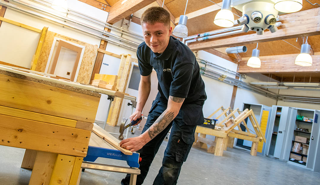 Photo of a CR Smith apprentice working in the training workshop