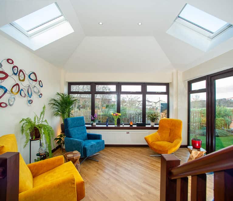 Internal view of sunroom with rosewood windows and two roof lights