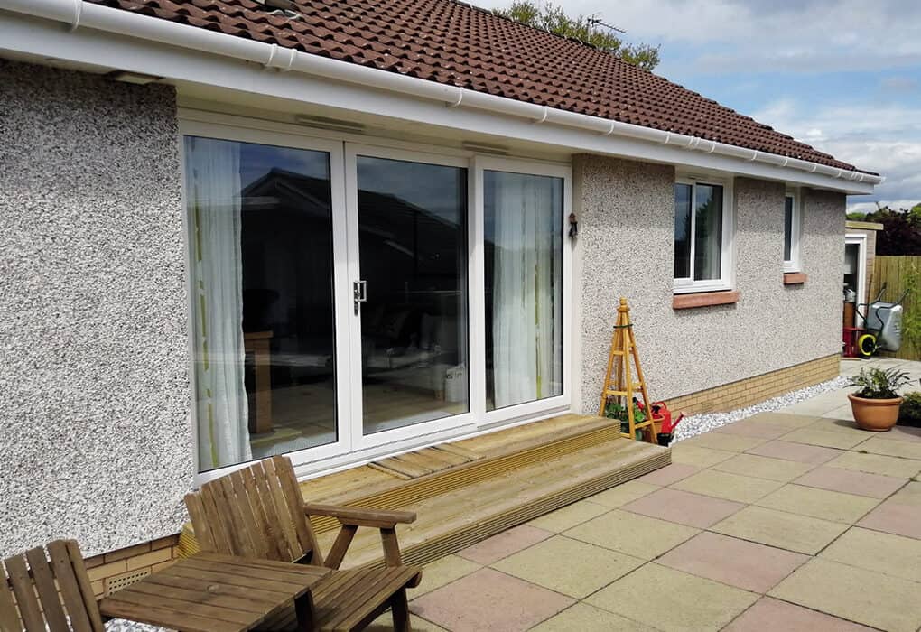 External view of white three part patio doors