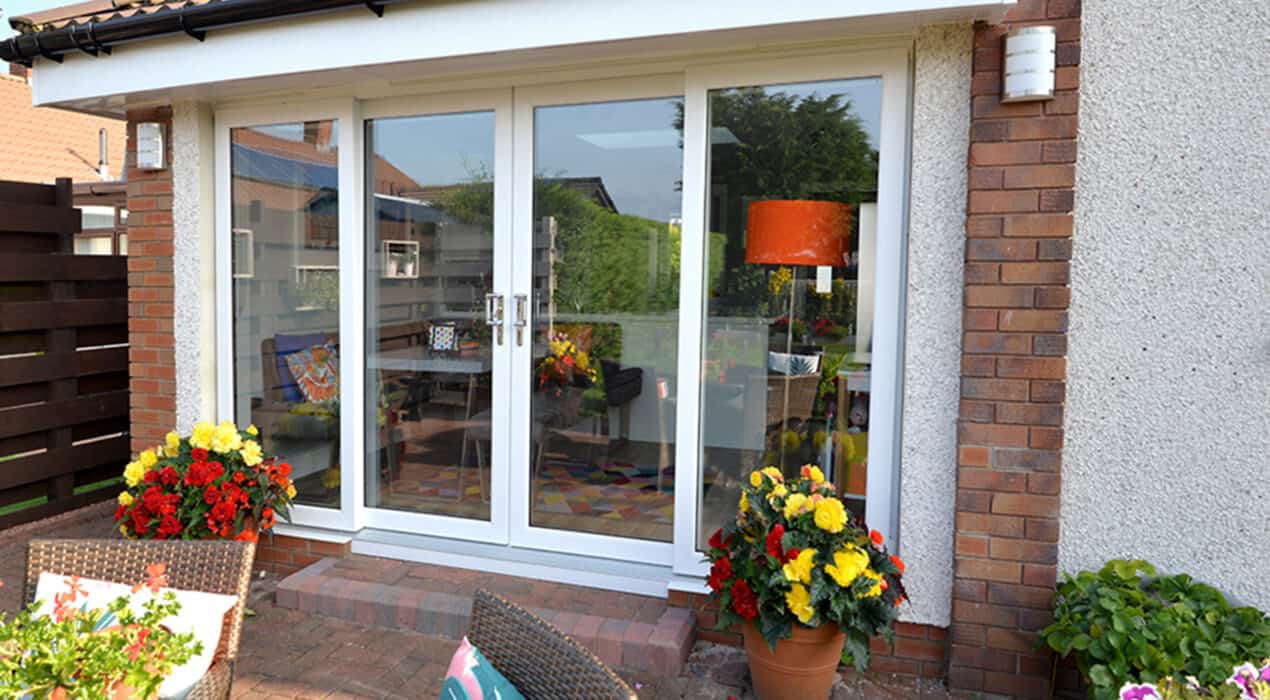 External view of white four part patio door