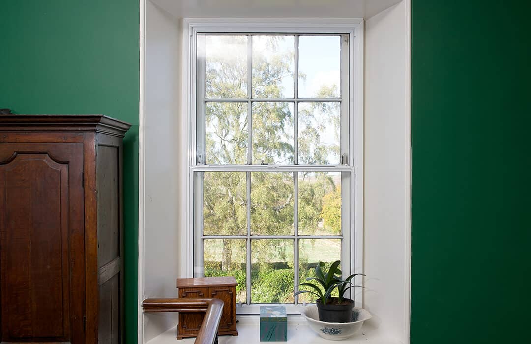 Old timber window fitted with secondary glazing