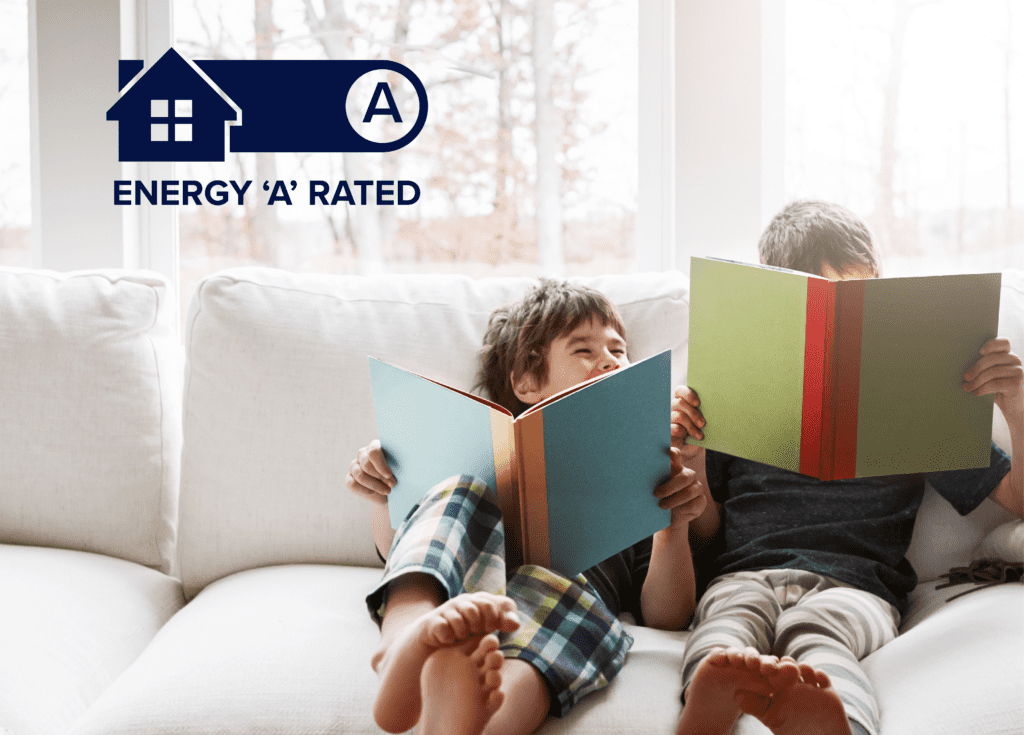 Two children sitting on the sofa reading books