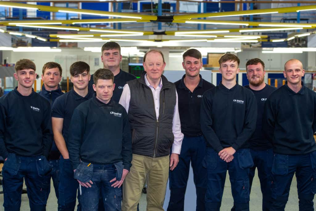 Photo of CR Smith apprentices with chairman Gerard Eadie