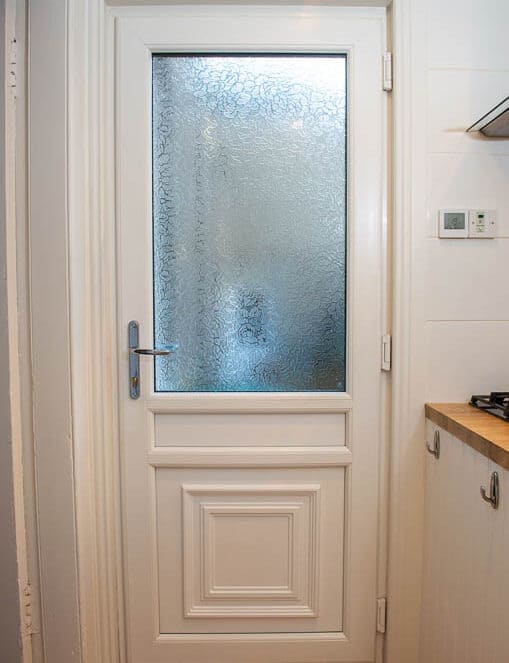 Internal view of white uPVC back door with obscure glass