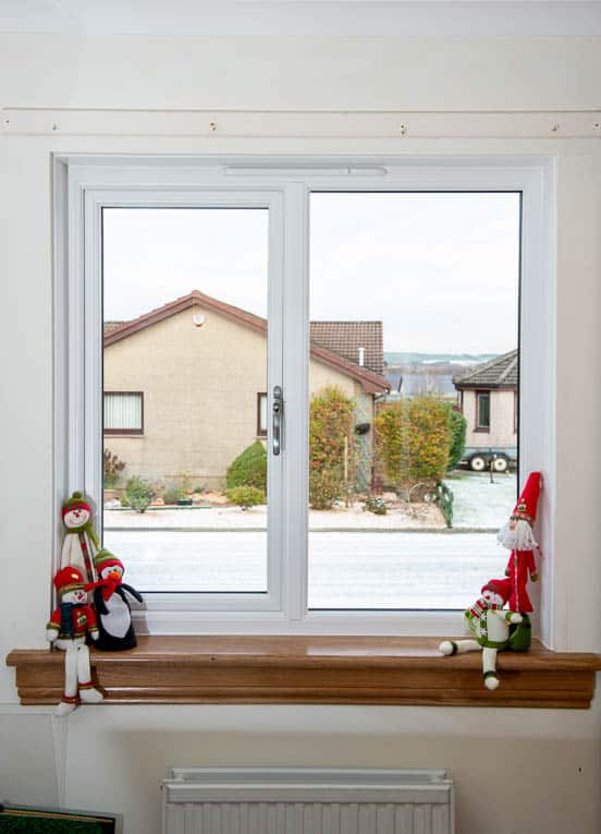 White casement window with royal oak timber window sills