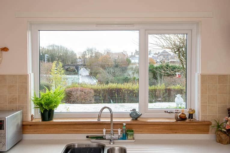 Kitchen with white casement window and royal oak timber window sills