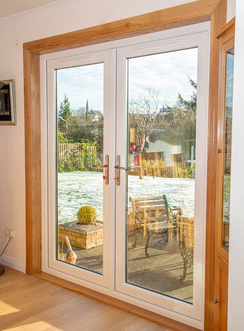 White french doors with royal oak timber surrounds