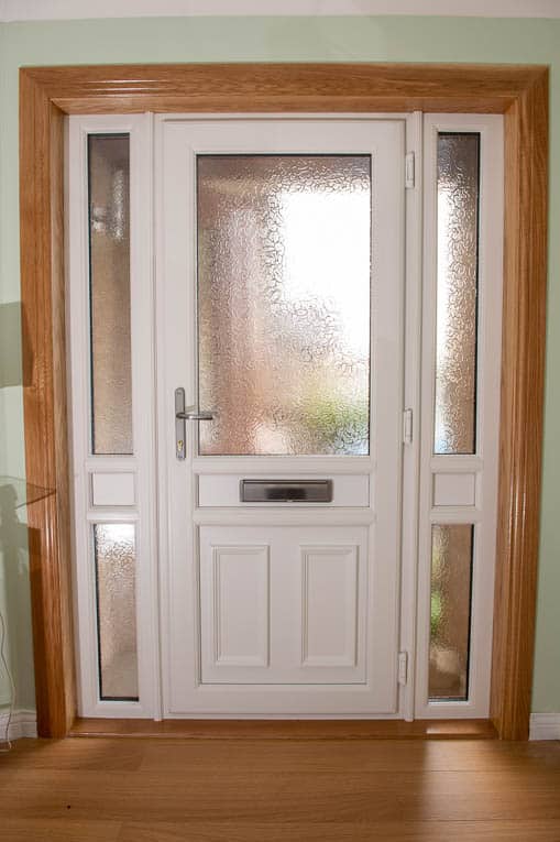 Internal view of white upvc front door with two glazed side panels