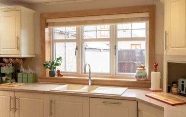 Internal view of white uPVC, double-glazed kitchen windows. Complete with Royal Oak sill and surroundings.